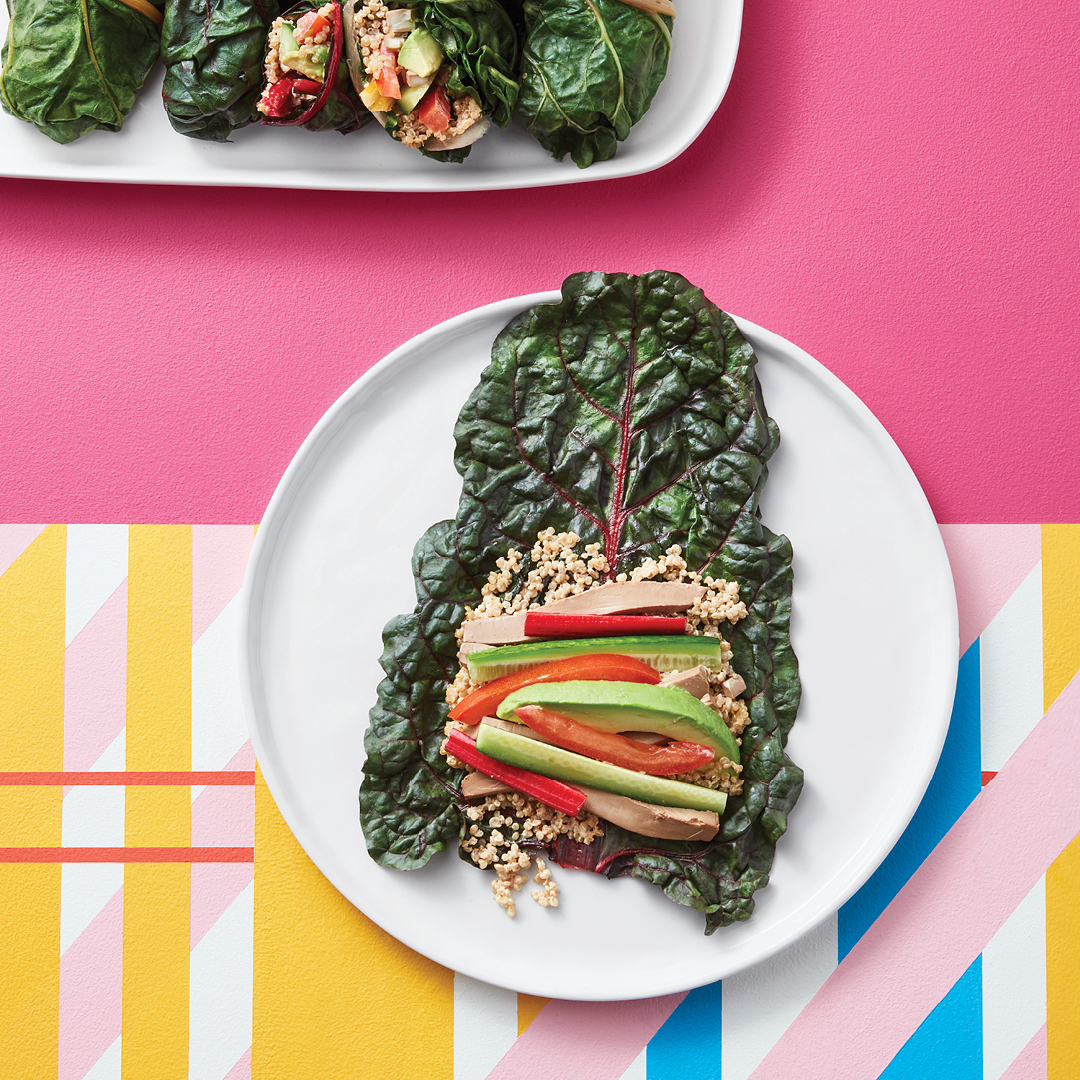 Tofu, quinoa, avocado and veggies on a rainbow chard leaf.