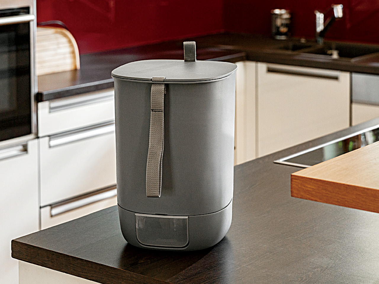 The Urbalive Bokashi Countertop Composter resting atop a kitchen counter