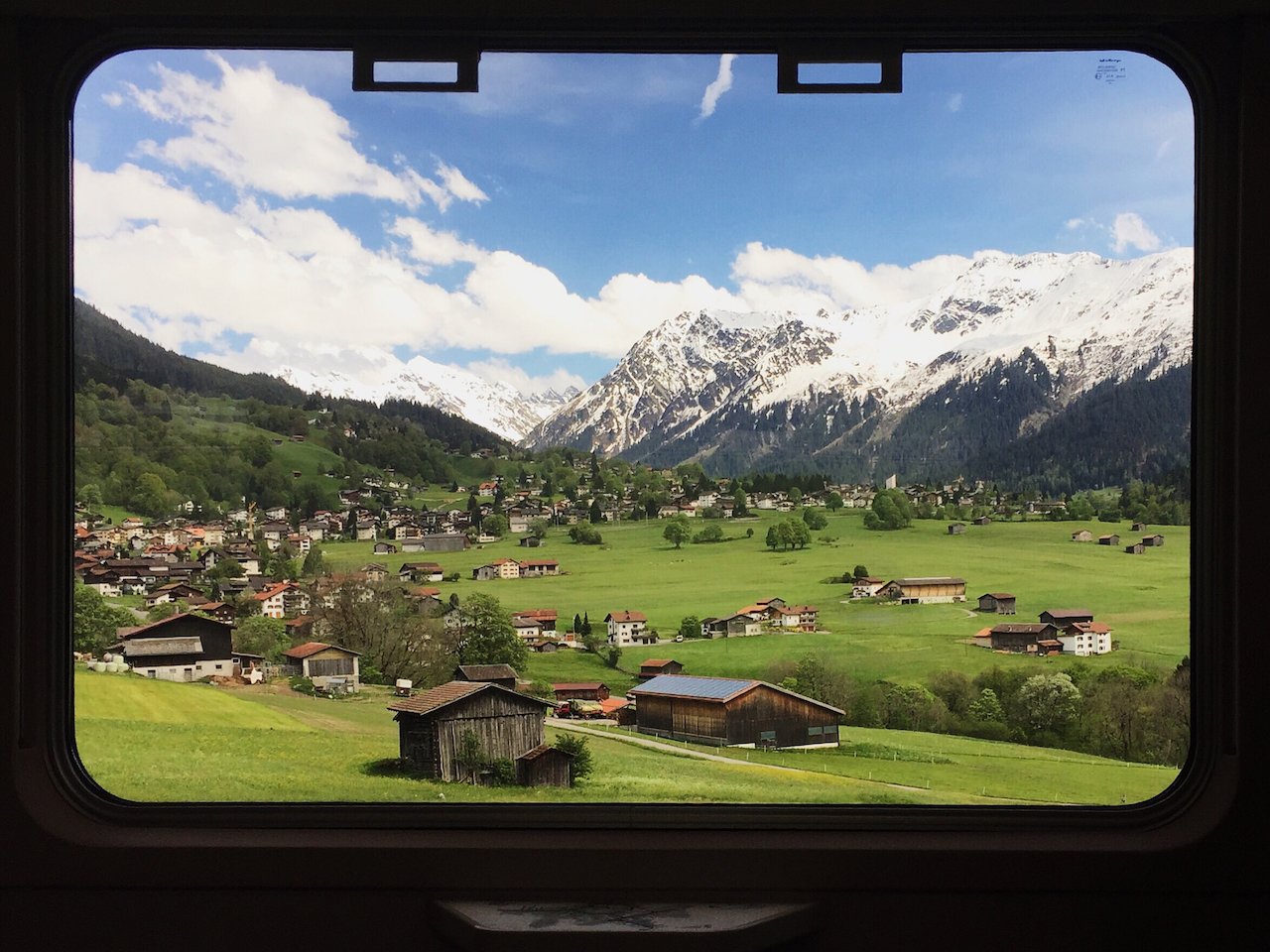Switzerland’s train system is so extensive, efficient and enjoyable to use that it’s a no-brainer to skip driving in favour of savouring views like this scene en route to St. Moritz. (Photo: Kat Tancock)