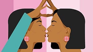 A woman with black hair and pink earrings, kissing her reflection.