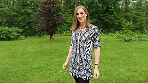 Natalie Moores poses in her backyard in Arnprior, Ontario. She is attending her first Pride as a trans woman.