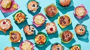 multiple arrangements of muffins with various coloured wrapping paper on a blue background.