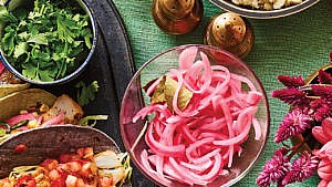 A bowl of pickled red onions