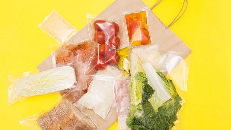 packaged ingredients for a meal kit salad