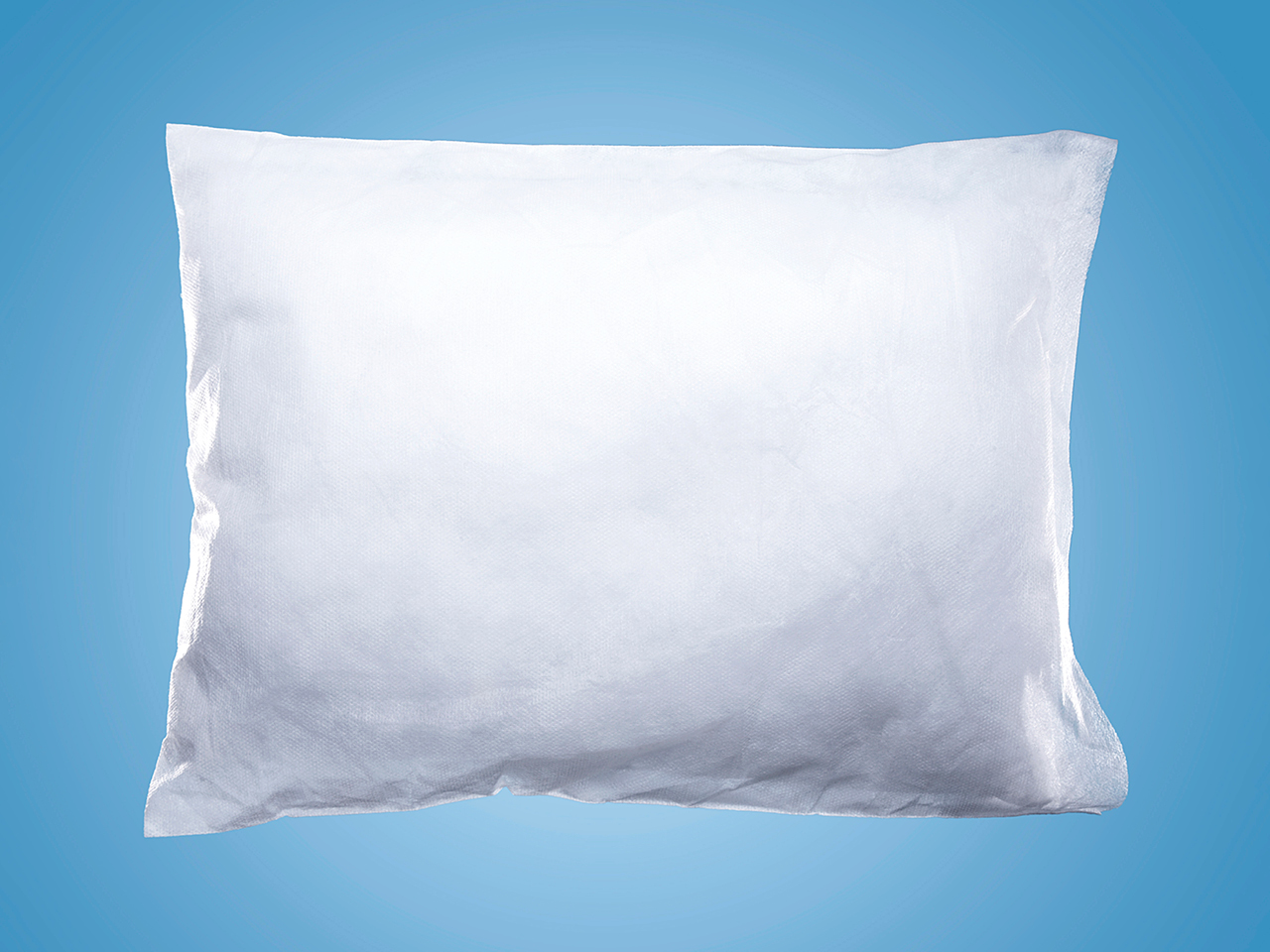A white pillow on a blue background