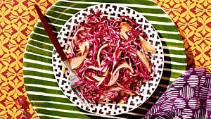 Sweet and sour chayote slaw served on a patterned plate