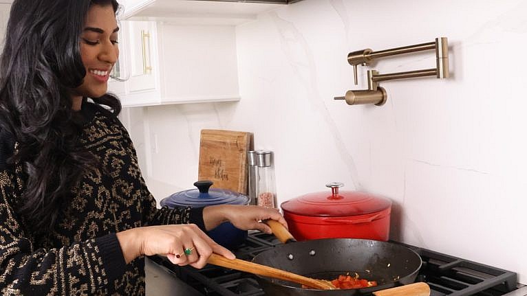 Vijaya cooking on her stove