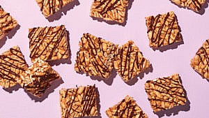 squares of puffed wheat squares drizzled in chocolate