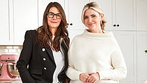 Simplified’s Megan Golightly, with Sarah Nicole Landry post inside a white kitchen