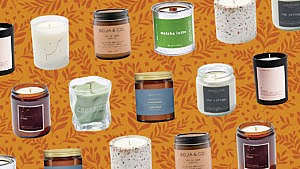 A collection of made-in-Canada cozy scented candles pictured against a leaf-patterned orange background.