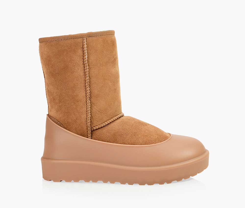 A pair of tan Ugg boots with sole guards in the same colour.