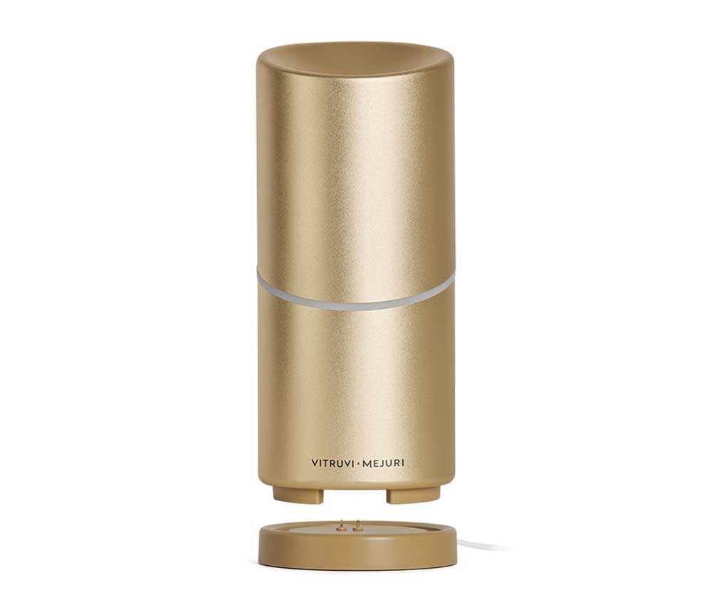 A gold portable essential oil diffuser by Vitruvi x Mejuri.