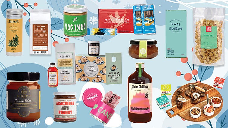 a selection of food gifts such as honey, chai syrup, chocolate peanut butter and gummy candies