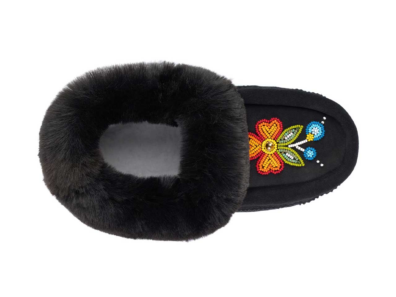 A black slipper with black fur and a beaded floral design seen from above.