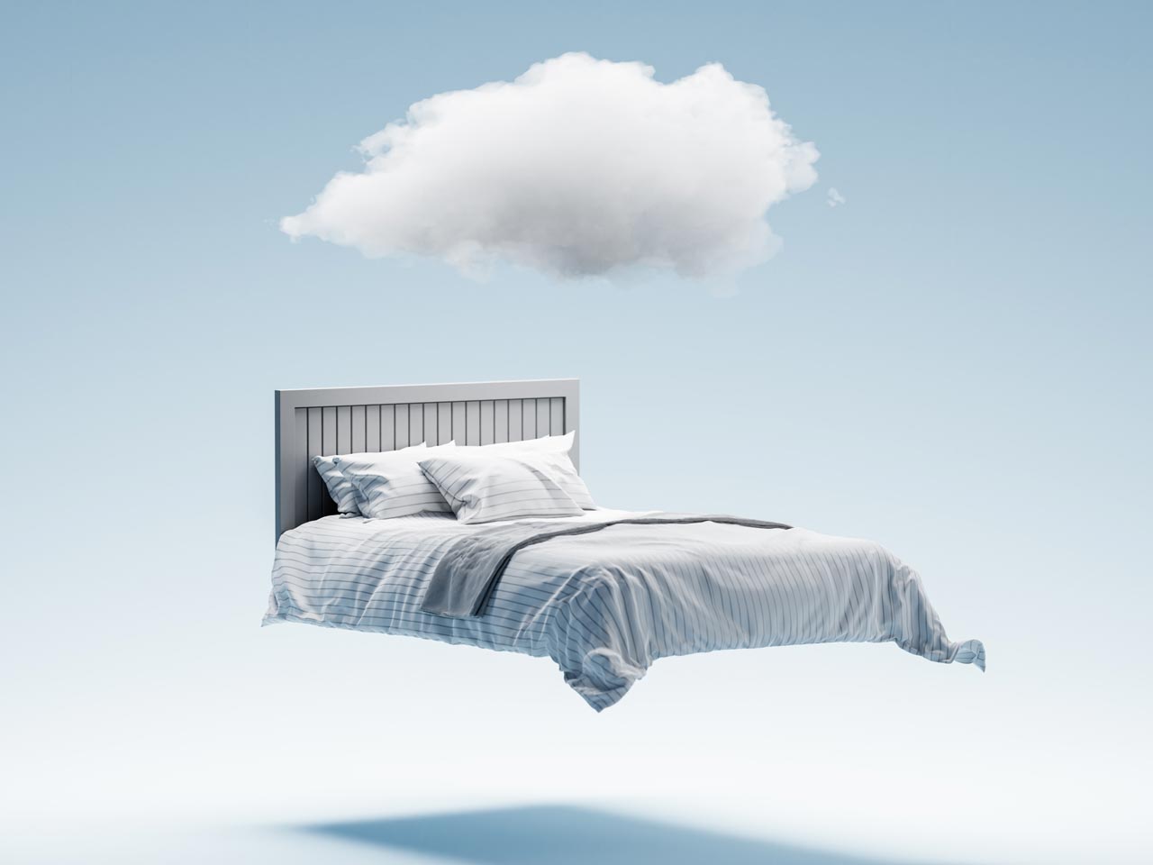 A bed floating in the sky with a cloud hovering above it, representing death wellness